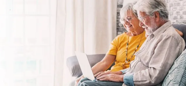 Older couple using a laptop